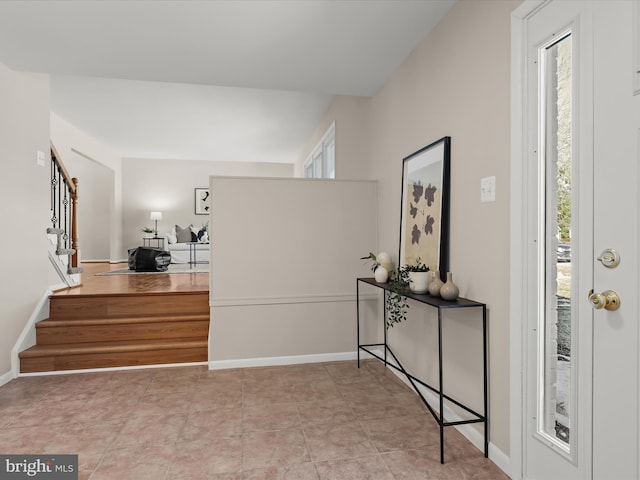 foyer entrance featuring light tile patterned floors