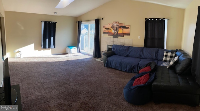 living room featuring lofted ceiling and carpet floors