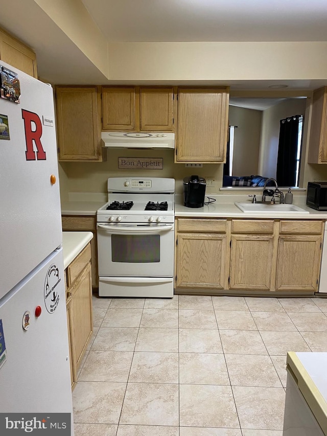 kitchen featuring sink, white appliances, light tile patterned floors, and light brown cabinets