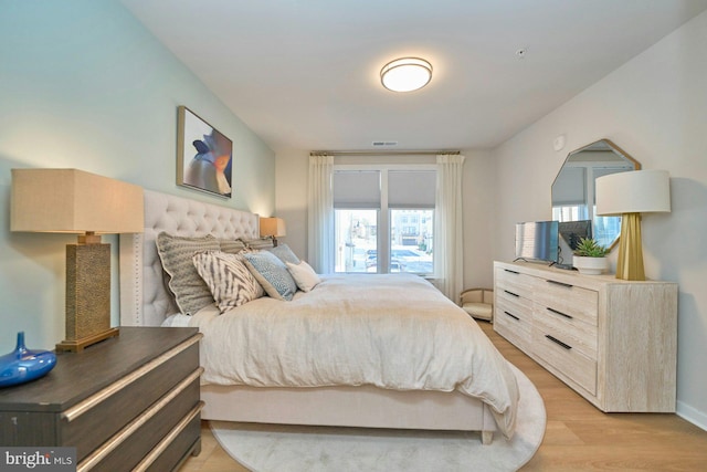 bedroom with light hardwood / wood-style floors