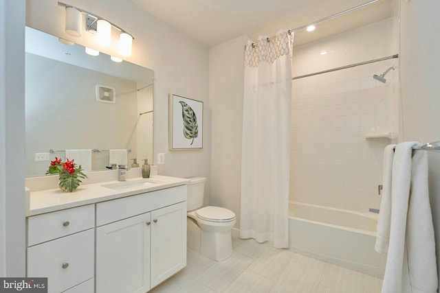 full bathroom featuring toilet, vanity, and shower / bathtub combination with curtain