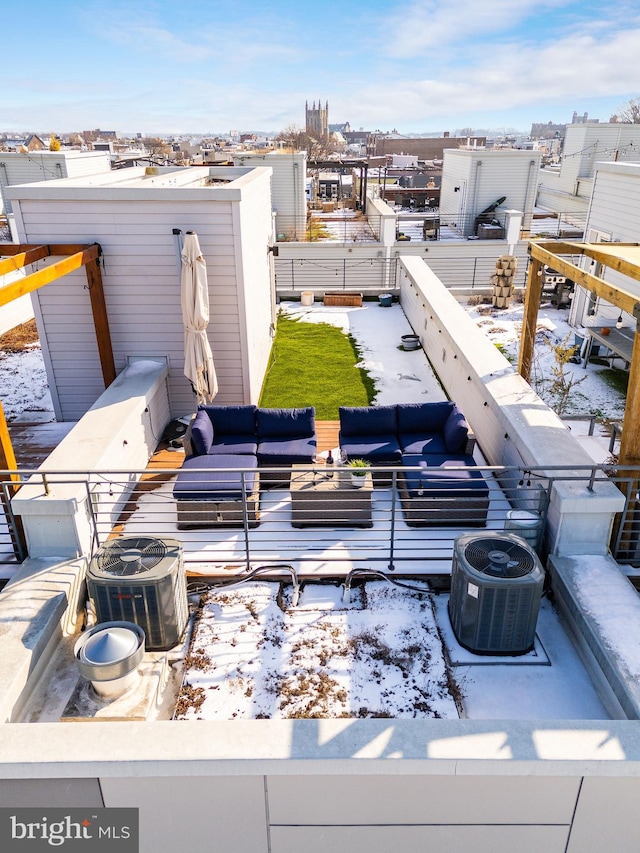 snow covered patio with outdoor lounge area