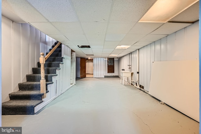 basement featuring a drop ceiling