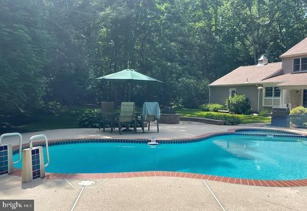 pool with a patio