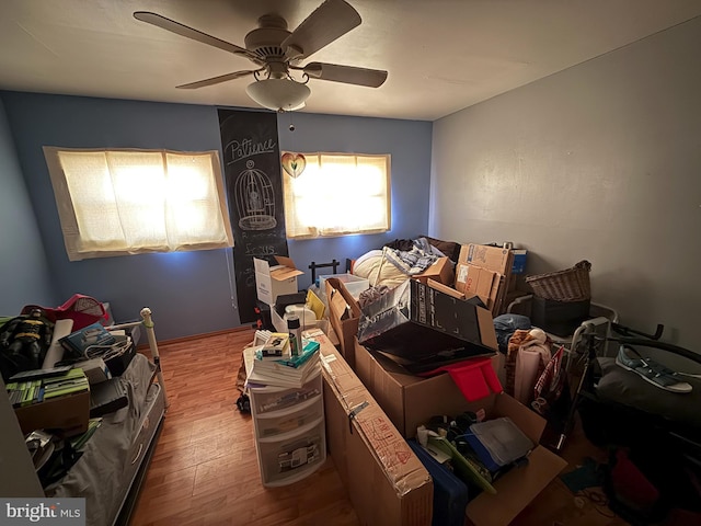 misc room featuring ceiling fan and wood-type flooring