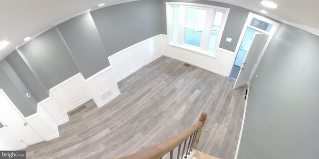 staircase with wood-type flooring