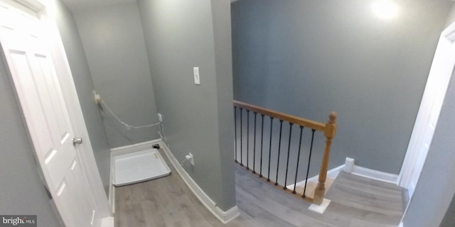 stairway featuring hardwood / wood-style floors