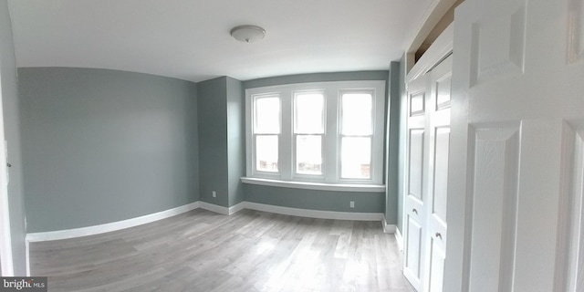 spare room with light hardwood / wood-style floors