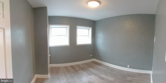 spare room featuring light hardwood / wood-style floors