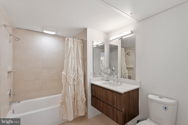 full bathroom featuring vanity, toilet, tile patterned flooring, and shower / bath combo with shower curtain