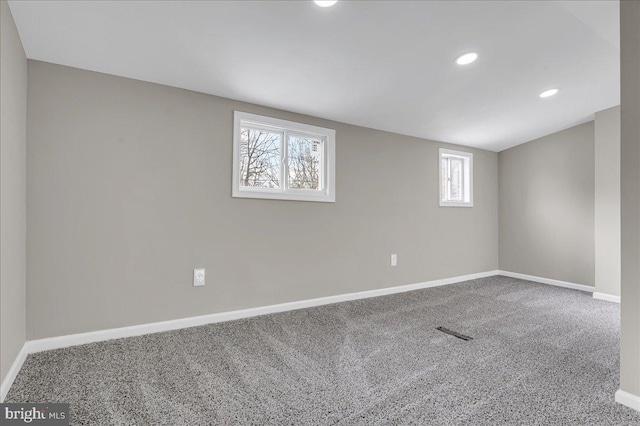 spare room with a healthy amount of sunlight and carpet