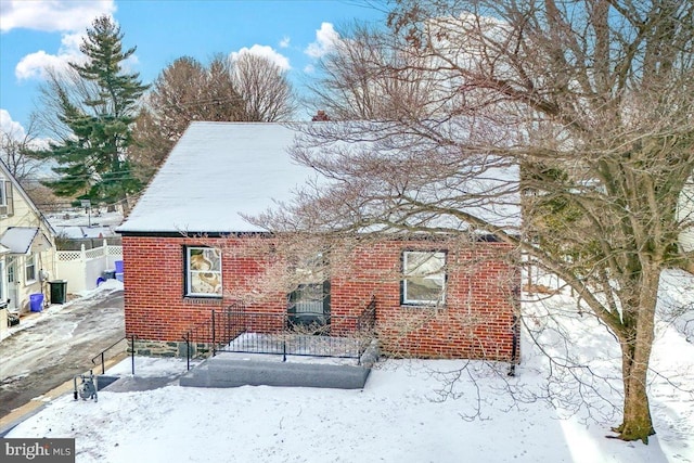 view of snow covered house