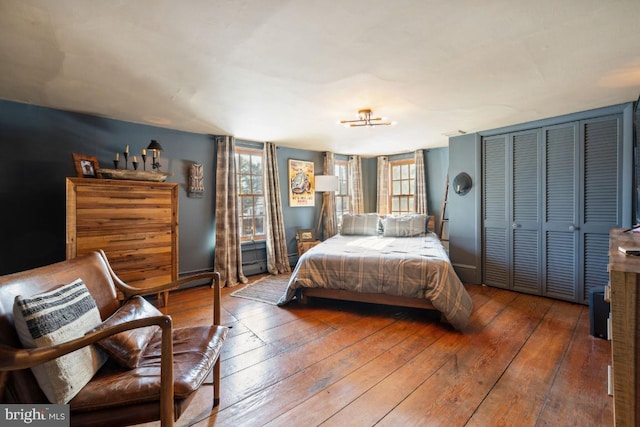 bedroom featuring hardwood / wood-style floors and a closet