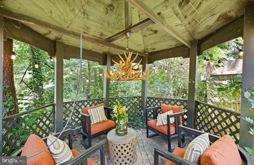 view of patio / terrace with an outdoor living space and a gazebo