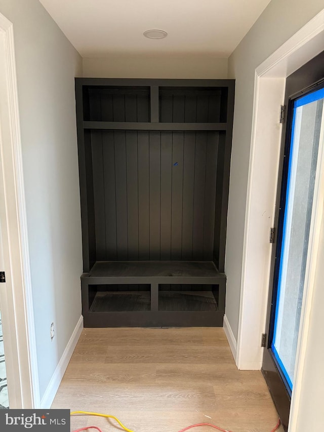 mudroom with light hardwood / wood-style floors