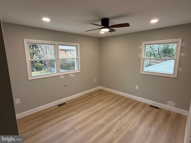 spare room featuring ceiling fan and light wood-type flooring