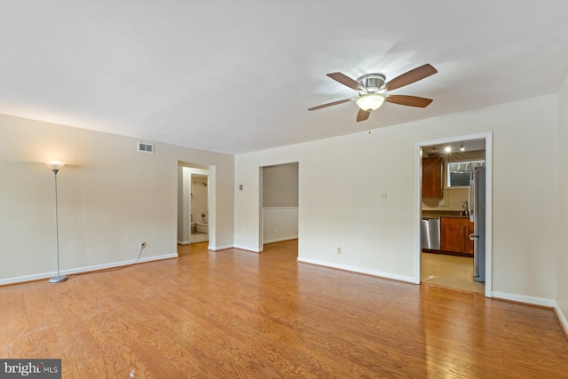 unfurnished room featuring light hardwood / wood-style flooring and ceiling fan