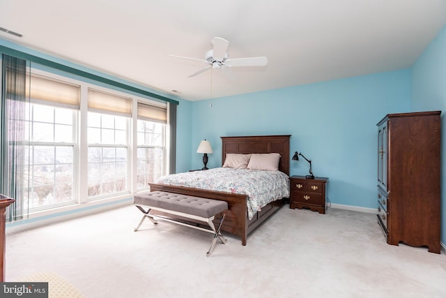 bedroom with a ceiling fan, carpet, visible vents, and baseboards