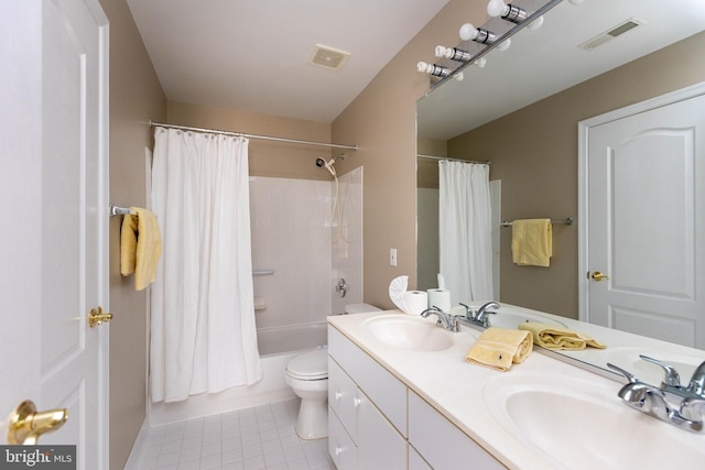 bathroom featuring a sink, visible vents, and tile patterned floors