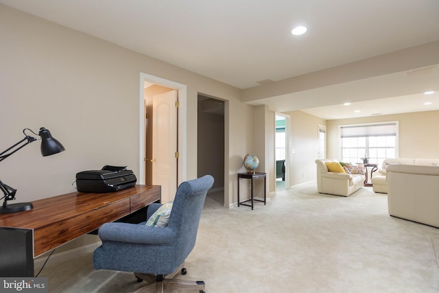 office space featuring recessed lighting, baseboards, and light colored carpet