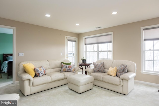 living room with carpet, visible vents, baseboards, and recessed lighting