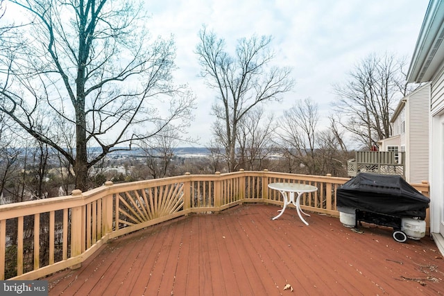 wooden deck with grilling area