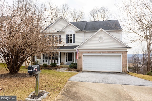 traditional home featuring driveway, a garage, a porch, and brick siding