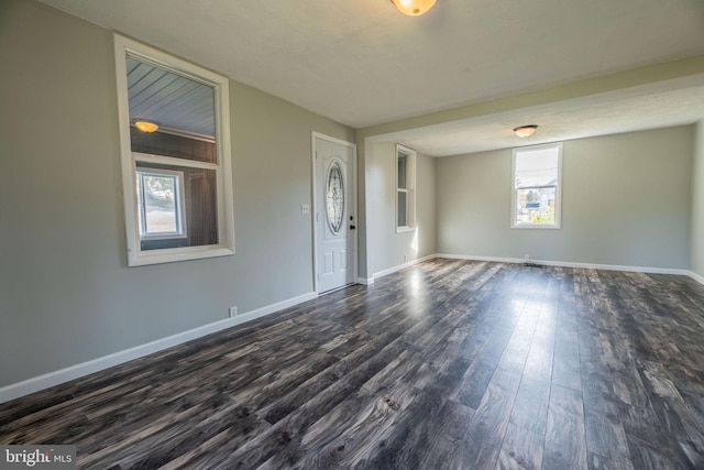 empty room featuring dark hardwood / wood-style flooring