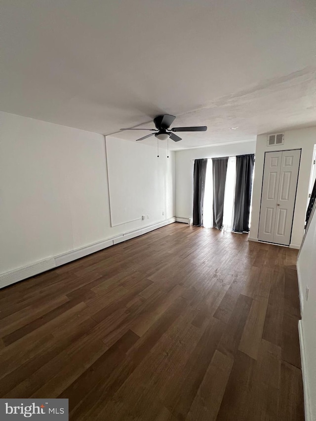 spare room with hardwood / wood-style floors and ceiling fan