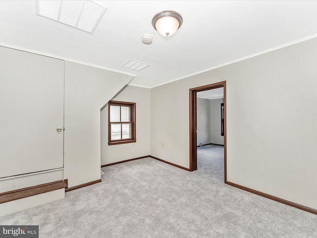 bonus room with light colored carpet