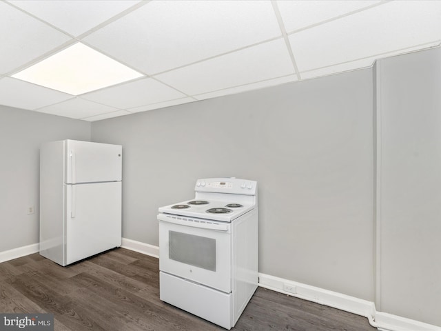 kitchen featuring dark wood-type flooring, white appliances, and a drop ceiling