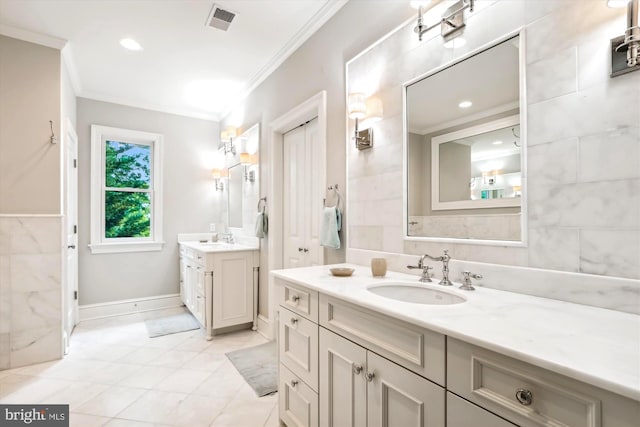 bathroom with crown molding and vanity