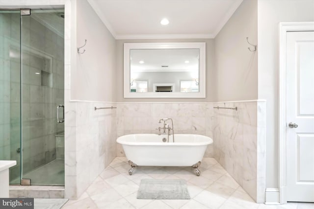 bathroom featuring crown molding, shower with separate bathtub, and tile walls