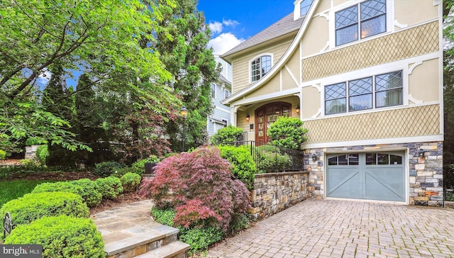 view of front of property with a garage