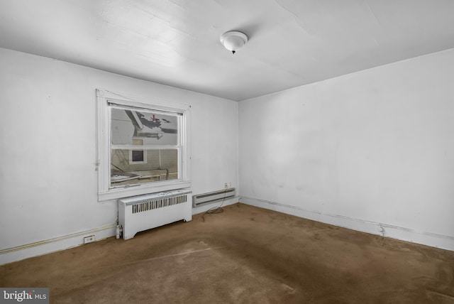 carpeted empty room with radiator heating unit and baseboard heating