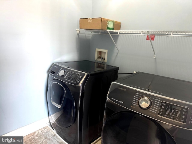 laundry room with separate washer and dryer