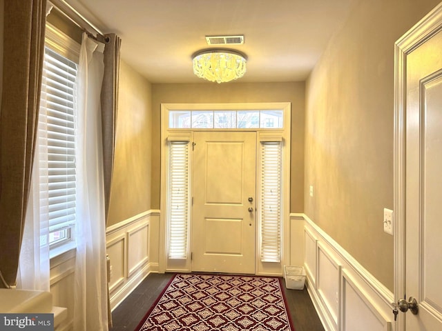 entrance foyer featuring dark hardwood / wood-style flooring