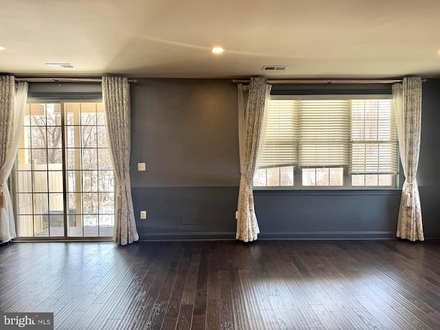 empty room featuring dark wood-type flooring