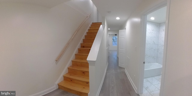 stairs with wood-type flooring