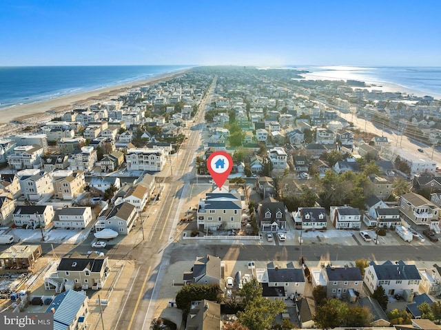 aerial view with a view of the beach and a water view