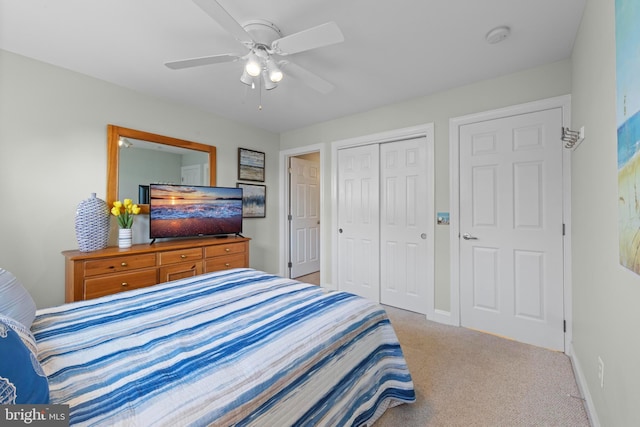 bedroom with light carpet, ceiling fan, and a closet