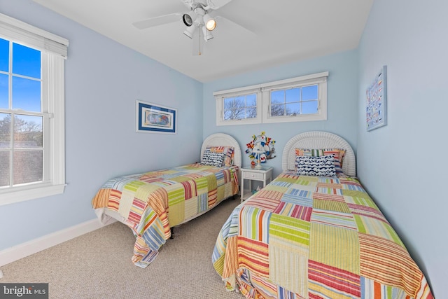 carpeted bedroom featuring ceiling fan