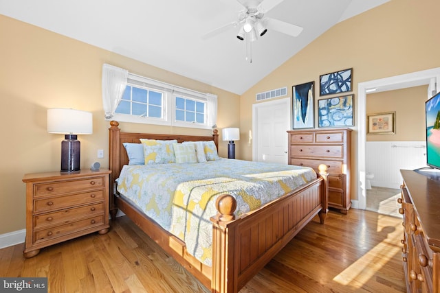 bedroom with vaulted ceiling, ceiling fan, and light wood-type flooring