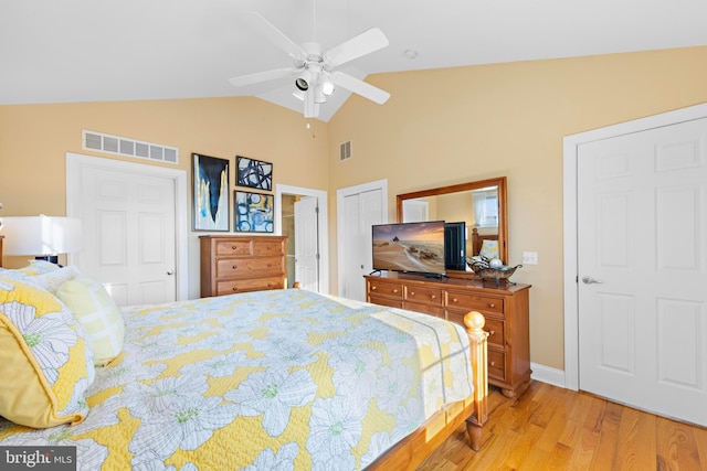 bedroom featuring lofted ceiling, light hardwood / wood-style flooring, and ceiling fan