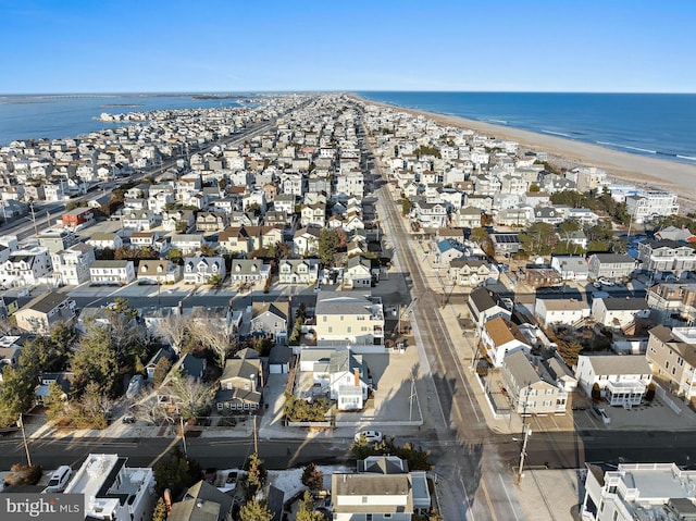 aerial view featuring a view of the beach and a water view