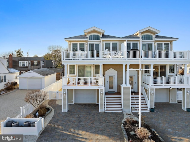 view of front of home featuring a balcony and a porch