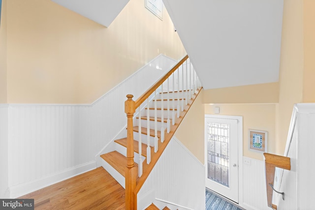 staircase with hardwood / wood-style floors