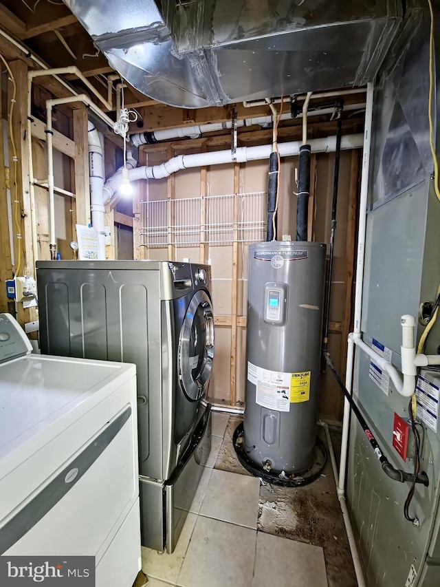 washroom with light tile patterned flooring, separate washer and dryer, and electric water heater