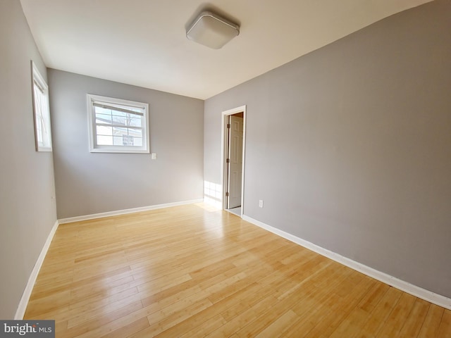 unfurnished room featuring light wood-type flooring