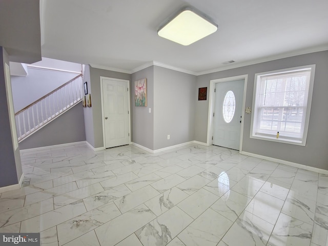 foyer featuring ornamental molding